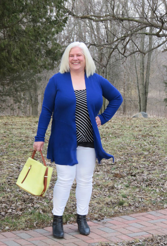 Julia wearing blue cardigan, striped top and white jeans | 40plusstyle.com