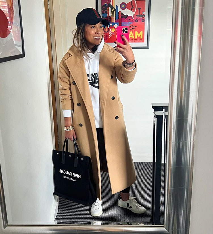 Abi in hoodie, coat, leggings and sneakers | 40plusstyle.com