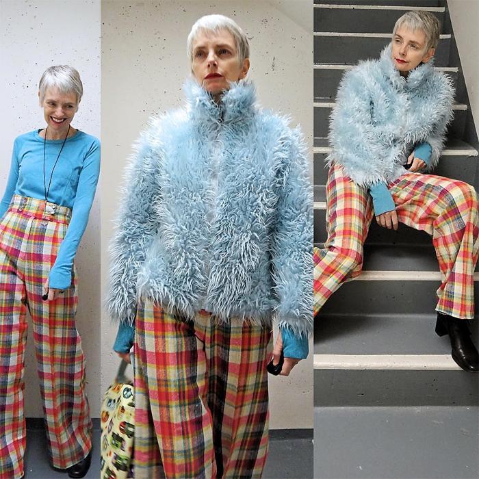 Melanie is wearing blue turtleneck sweatshirt over powder blue faux fur jacket and striped plaid pants | fashion over 40 | 40plusstyle