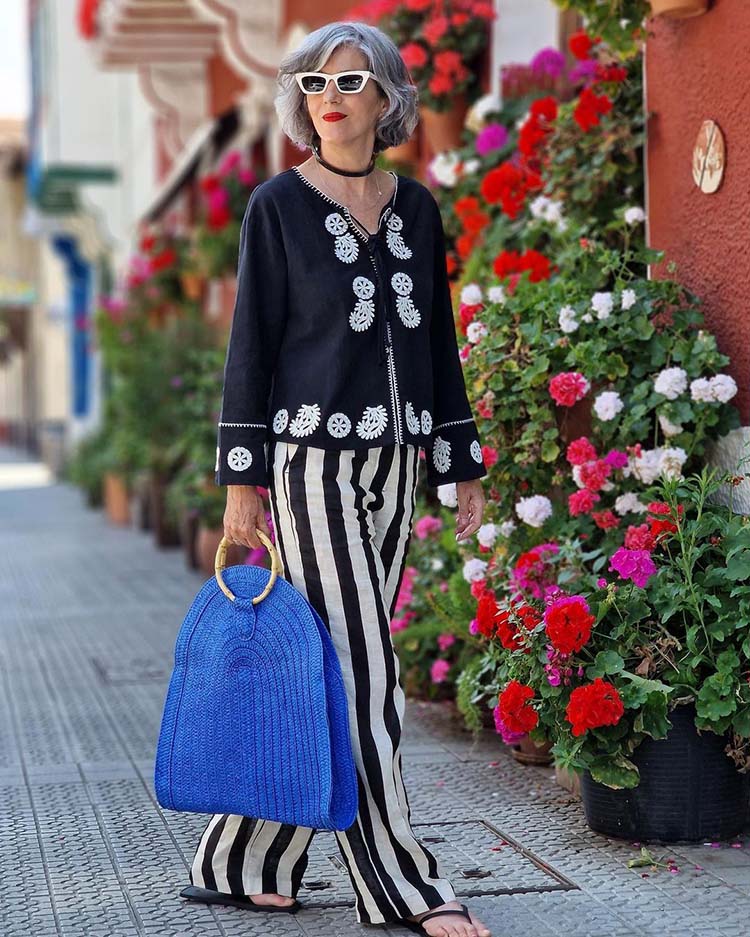 Carmen wears striped pants | 40plusstyle.com