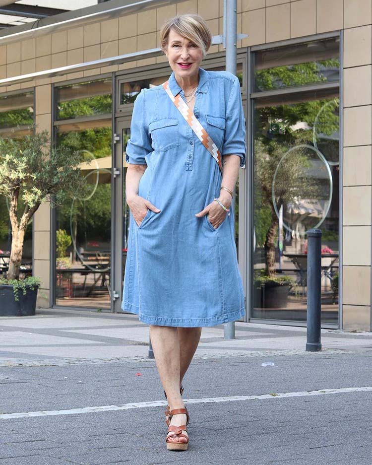 Claudia wears a denim dress and tan sandals | 40plusstyle.com