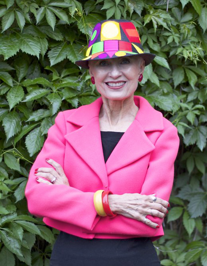 Judith in pink blazer and colorful hat | 40plusstyle.com