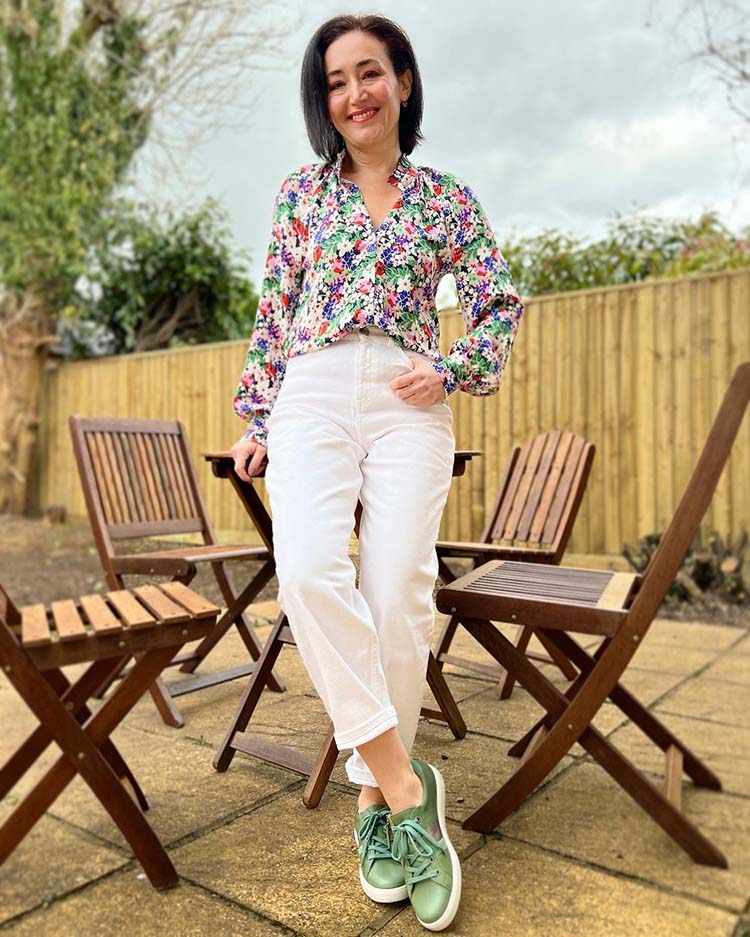 Emms wears a floral shirt and cropped jeans | 40plusstyle.com