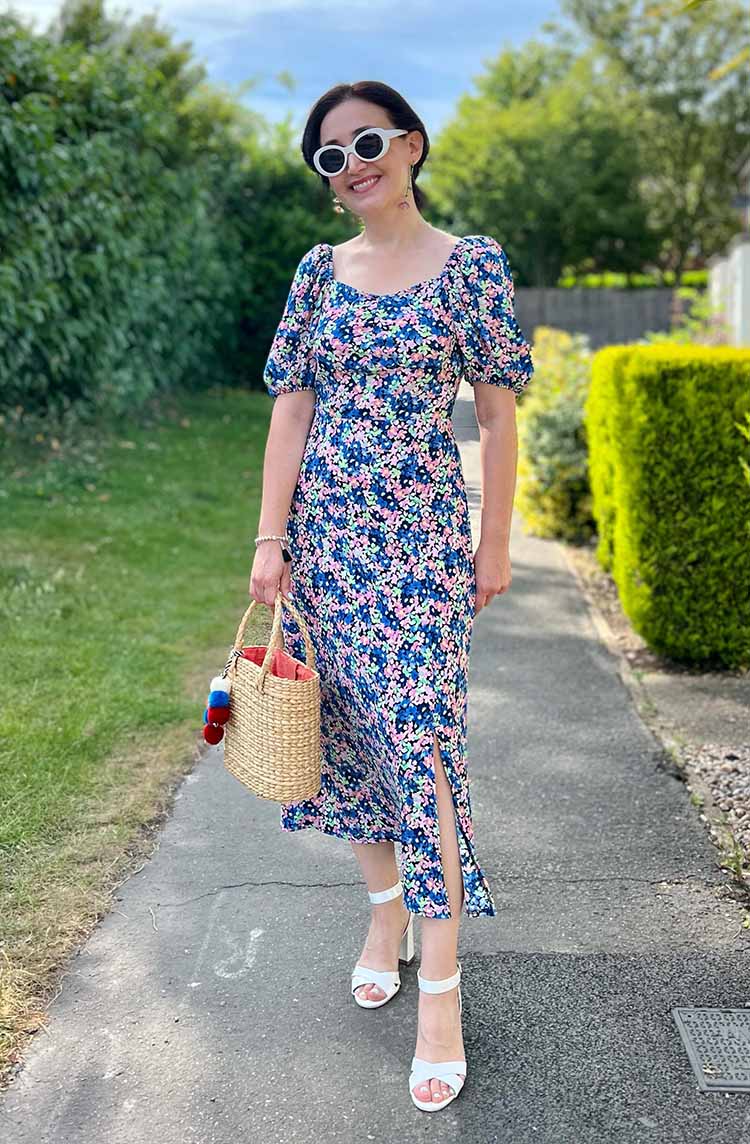 Emms wears a floral dress | 40plusstyle.com