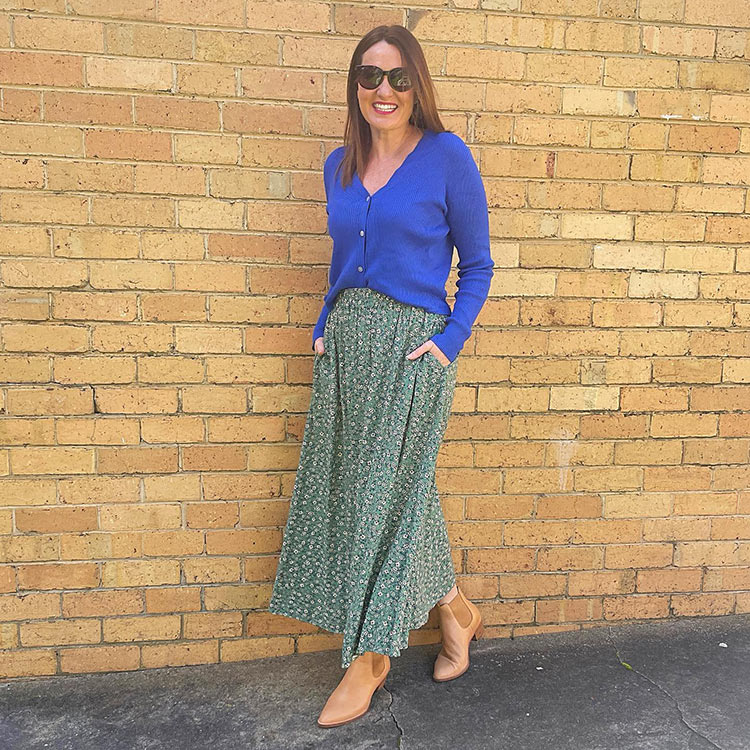 Karen in cardigan, printed skirt and booties | 40plusstyle.com