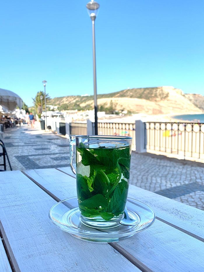 Sipping mint tea on the main boulevard in Praia da Luz, Portugal | 40plusstyle.com