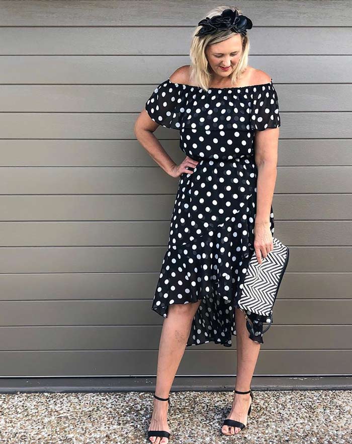 Dresses to wear for the rectangle body shape - Nic wearing a polka dot high/low piece | 40plusstyle.com