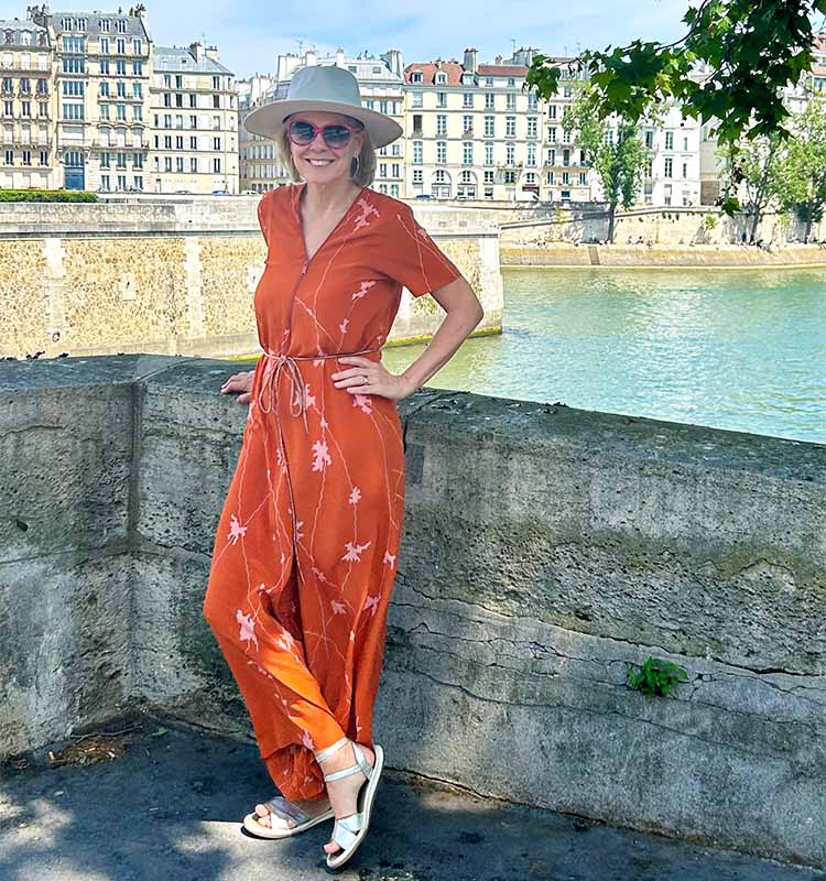 Sylvia wears an orange jumpsuit | 40plusstyle.com