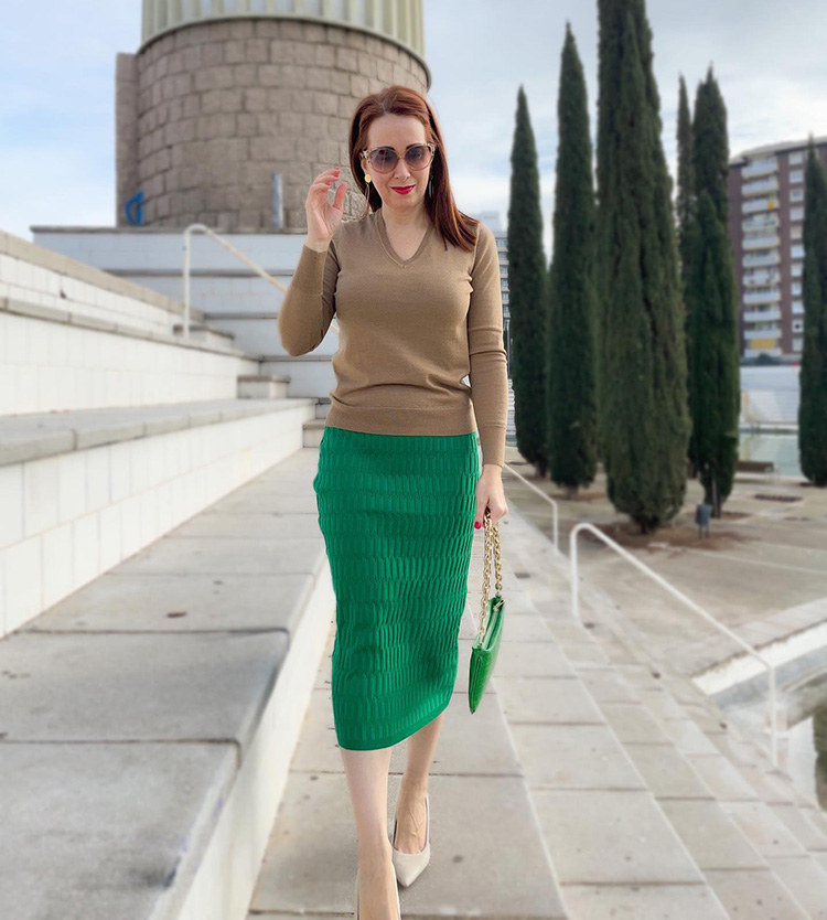 Patricia in a sweater and green skirt | 40plusstyle.com