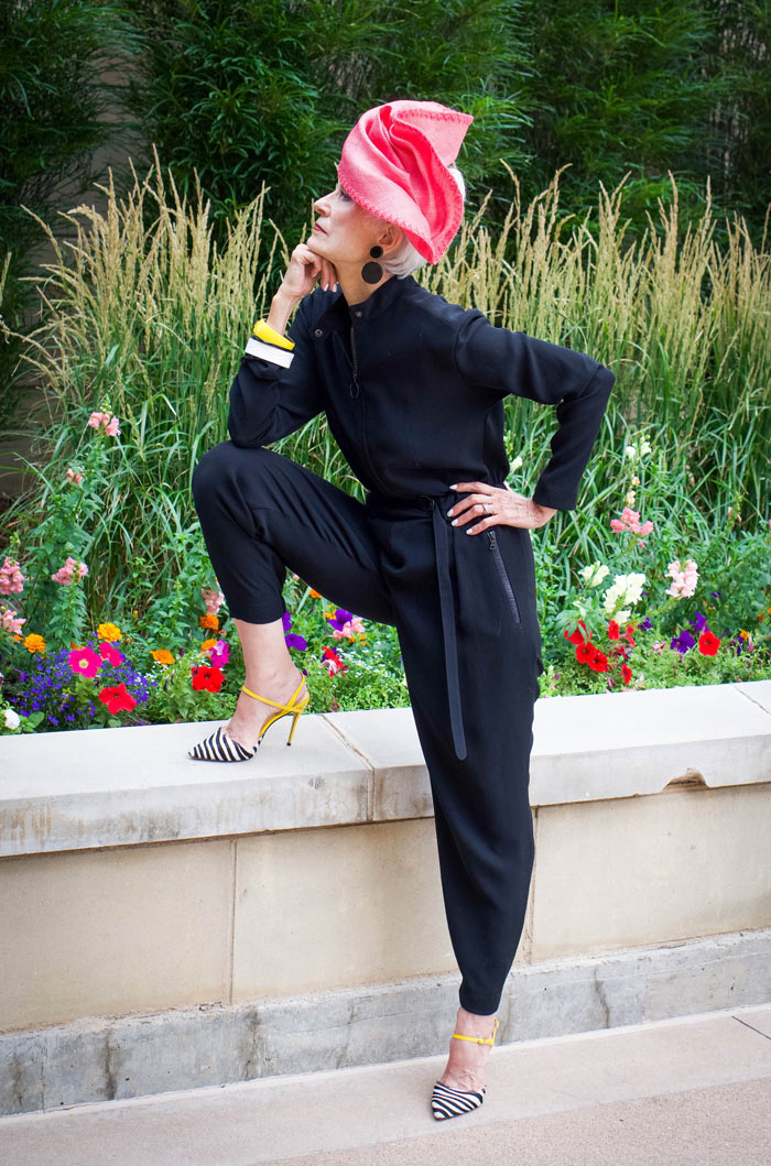 Judith in black jumpsuit and pink hat | 40plusstyle.com