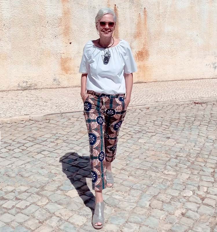 Sylvia in a white top and print pants | 40plusstyle.com