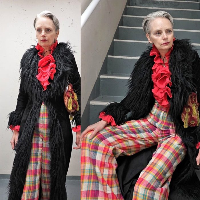 Melanie is wearing Red ruffles over black long coat with plaid pants | fashion over 40 | 40plusstyle