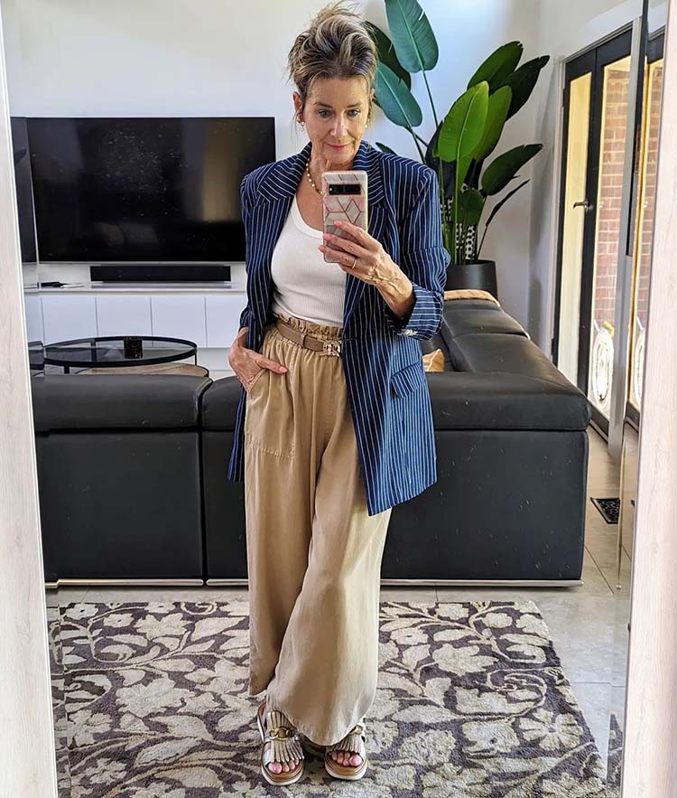 Suzie wears a striped blazer and wide pants | 40plusstyle.com