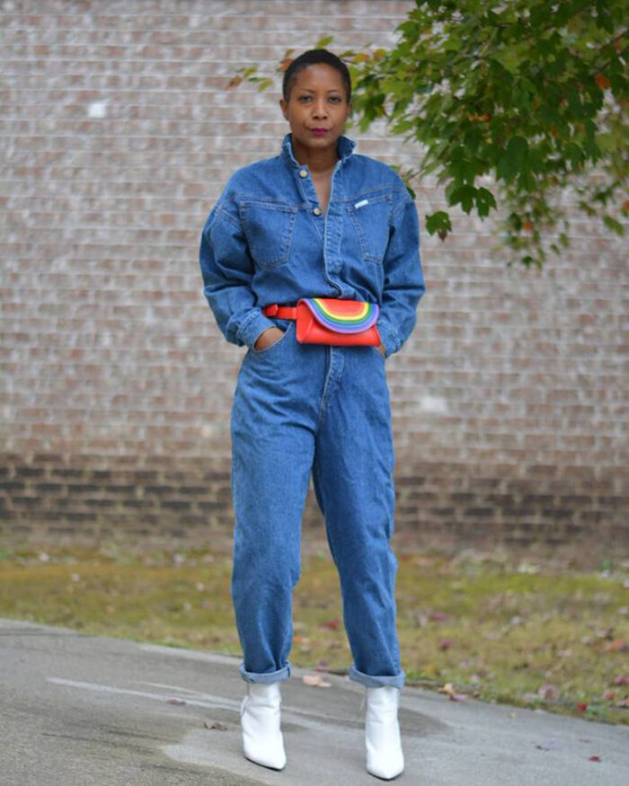 Troy wears a denim jumpsuit with her white boots | 40plusstyle.com